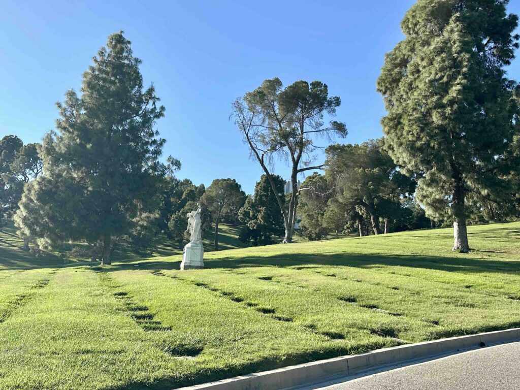 View of Sunrise Slope with statue at Forest Lawn Memorial Park Glendale - Bayer Cemetery Brokers