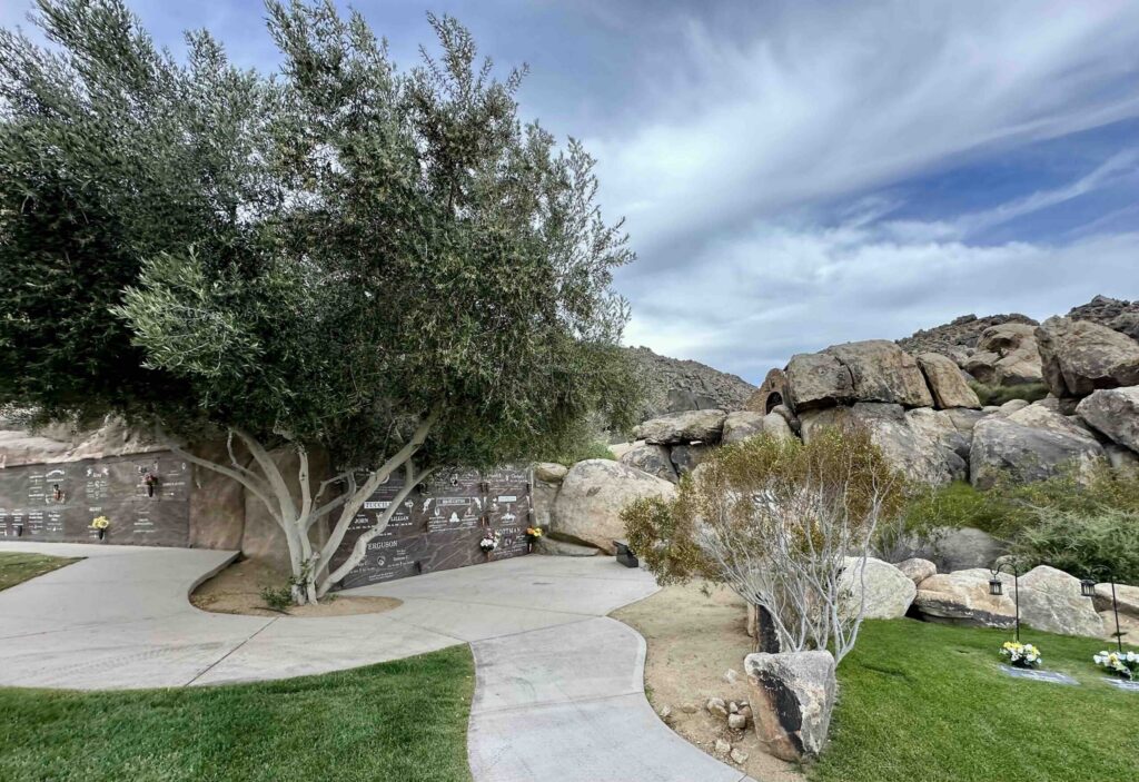Eternal Rocks deluxe companion Crypts with olive tree and well-maintained landscaping at Sunset Hills Memorial Park Apple Valley - Bayer Cemetery Brokers